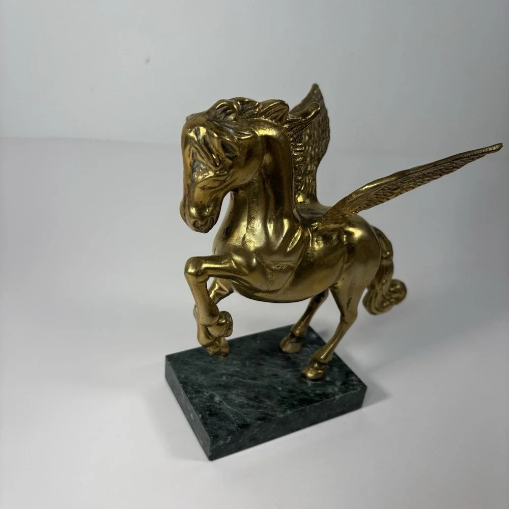 vintage solid brass Pegasus figurine mounted on a green marble base,